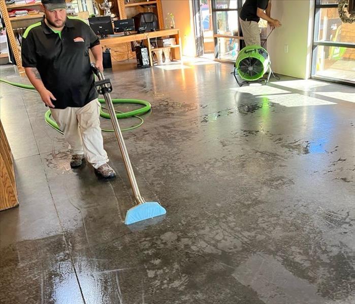 technician using a wet vacuum