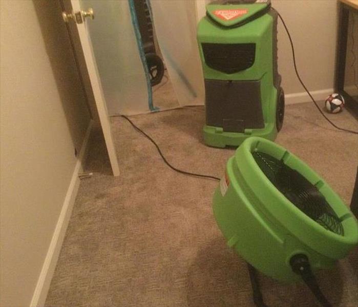 green equipment on carpet from water damage in cal expo