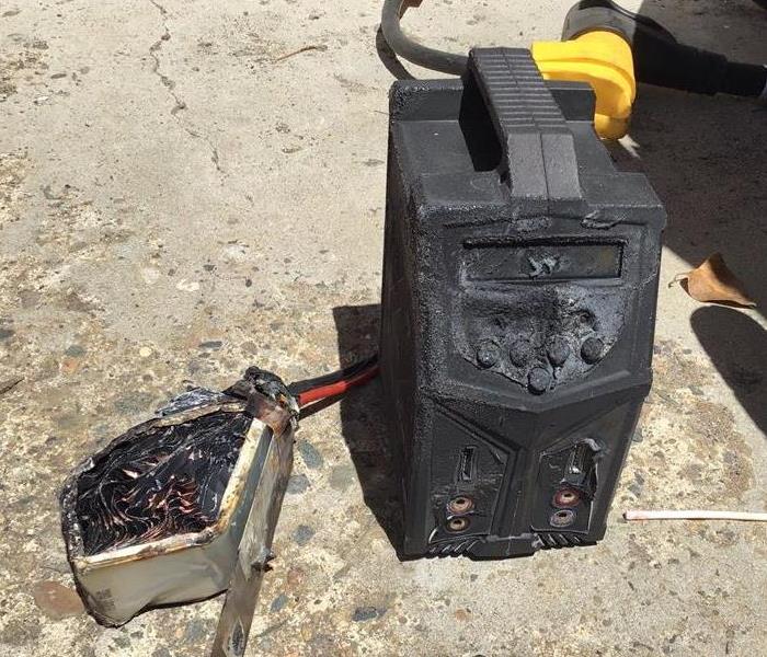 black rc battery box with burnt wiring and coil causing fire damage in sacramento