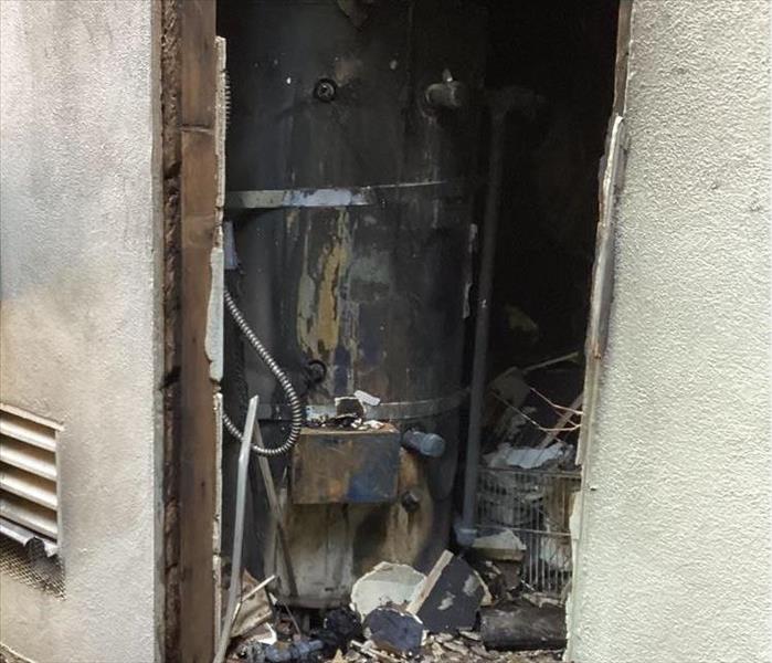 fire damage caused by water heater burst in apartment complex in sacramento