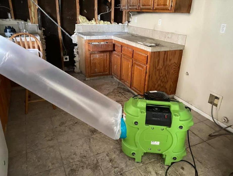 green machine air scrubber with plastic tube, kitchen fire, cabinet, wall damage, fire damage near carmichael, containment