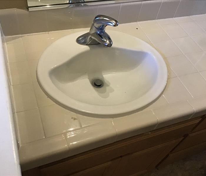 oval sink on countertop. sink damage near me. water damage in carmichael.