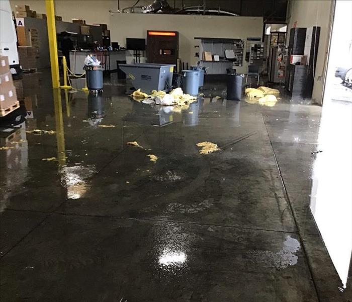 water damage in warehouse, affected wet materials and wet supplies