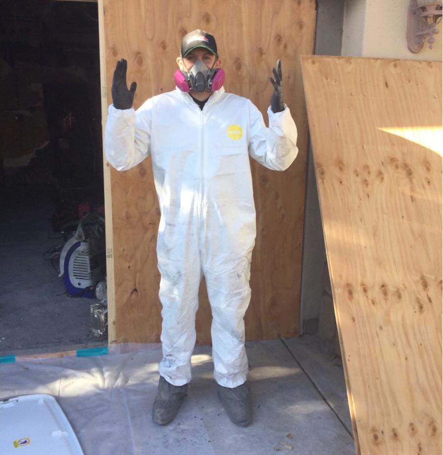 male wearing PPE equipment for biohazard near Carmichael near me near Cal Expo near Wilhaggin near Sacramento near Sac